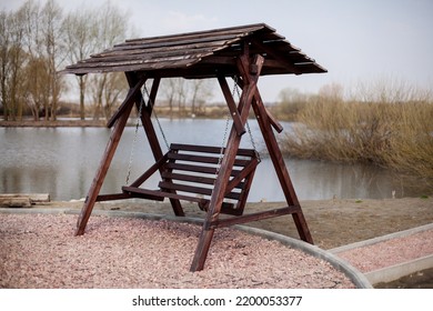 Wooden Gazebo Swing On The Lake