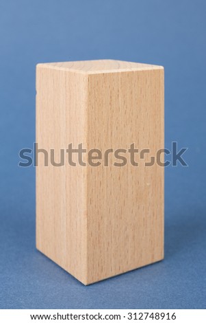 wooden geometric shapes on a blue background