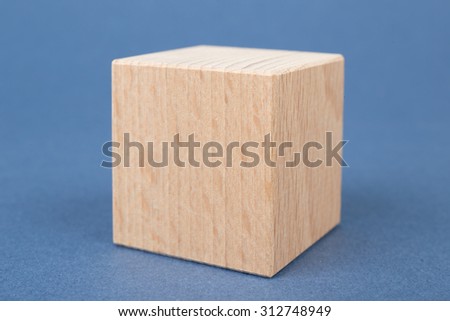 wooden geometric shapes on a blue background