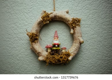 Wooden gnome decoration with glitter, moss and mushrooms