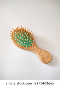 A Wooden Hair Comb Isolated In White Background, Used For To Clean, Untangle And Style The Hair. 