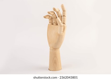 Wooden hand of mannequin on white background - Powered by Shutterstock