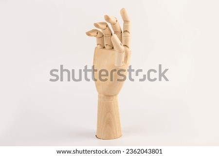 Wooden hand of mannequin on white background