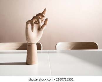 Wooden Hand On Office Desk, Front View