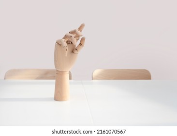 Wooden Hand On Office Desk, Front View