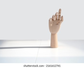 Wooden Hand On Office Desk, Front View