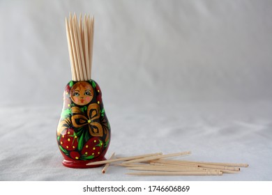 Wooden handmade toothpick stand in the shape of a Russian 'Matryoshka' or 'Babushka' doll