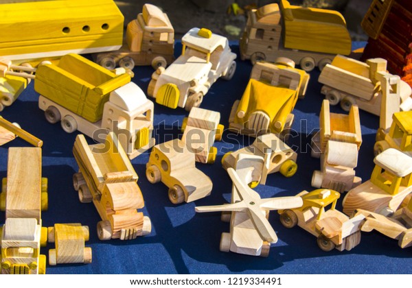 wooden handmade toys. wooden toy mill. Miniature\
toy. Carpenter produce wooden car toy. The wooden industry.\
Invention and crafts\
concept.