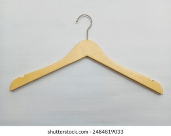 Wooden Hanger with Silver Iron on a White Background that is very aesthetic - Powered by Shutterstock