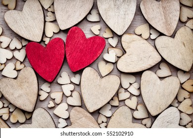 Wooden hearts, one red heart on the heart background. - Powered by Shutterstock