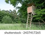 Wooden high seat for hunting in the countryside