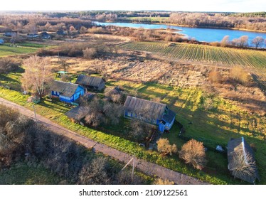 Wooden Home In Village At Lake. Country Houses In The Countryside. Aerial View Of Roofs Of Rural Homes. Suburban House At Countryside. Rural Housing Outside The City. Russian Region In Countryside.