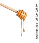 Wooden honey dipper with dripping honey close up isolated on a white background