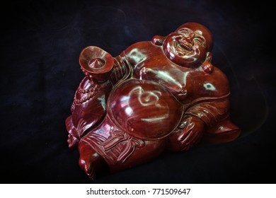 wooden Hotei  - Powered by Shutterstock