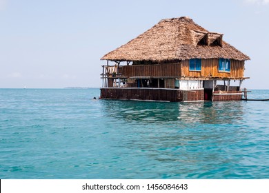 Wooden Hotel On The Water In Zanzibar, Beautiful Blue Water, Blue Sky