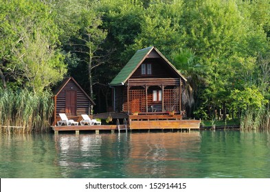 wooden house along the lush Ada Bojana riverside, Montenegro