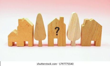 Wooden House With Clock, Business Concept Of Housing Market Trends And Property Value. When Is The Best Time To Buy House Or Real Estate Investment After Financial Impact From Coronavirus Crisis.