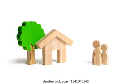 Wooden House And Family. Buying A New Home. State Program Of Assistance To Young Families. Subsidy. Rental Housing, Mortgage And Loans. Quiet And Comfortable Home In The Suburbs. Investment.