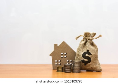 Wooden House  With Property Investment Financial Concept.
Home Loan Provide A Great Range With Competitive And Variable Interest Rates As Well. Mortgage Payment And Real Estate Investment Concept. 