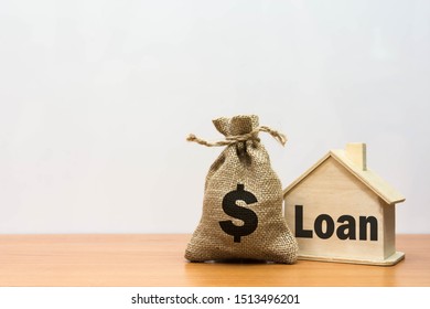 Wooden house  with property investment financial concept.
Home Loan provide a great range with competitive and variable interest rates as well. Mortgage payment and real estate investment concept. 
