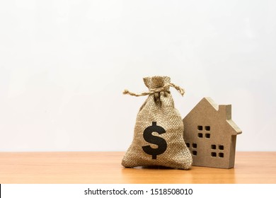 Wooden house  with property investment financial concept.
Home Loan provide a great range with competitive and variable interest rates as well. Mortgage payment and real estate investment concept. 