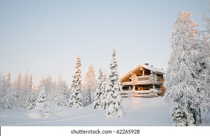 Wooden House In Winter Forest