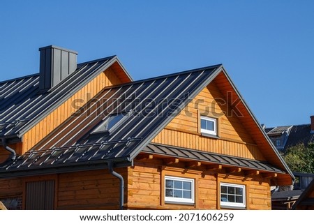 Wooden houses. Classic metal roof. Colorful Houses. Roofing. Anthracite roof. Orange Facade. Metal roofing. RAL7016