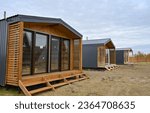 Wooden houses in a triangular summer camp. summer vacation in an eco-friendly house, summer