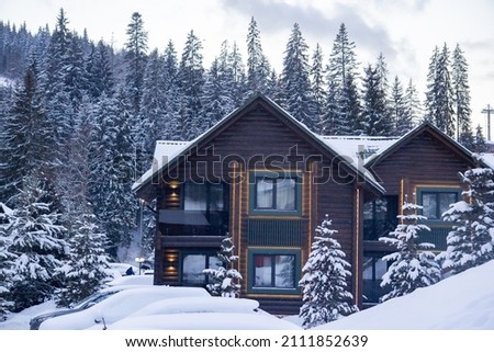 wooden houses in winter mountains, ski resort