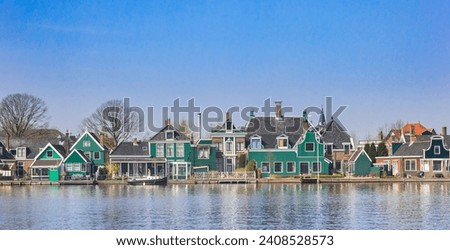 Wooden houses at the Zaan river in Zaandijk, Netherlands