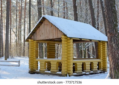 Wooden Hut Or Picnic Pavillion In The Winter Forest