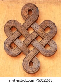 Wooden infinity knot. 