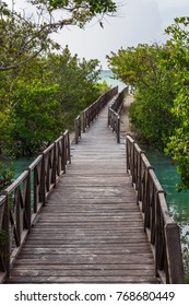 A Wooden Jetty Crosses A Deep Channel Of Water On The Way To A Beach At Cayo Coco In Cuba.