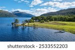 Wooden jetty on Loch Lomond in the Trossachs National Park, Scotland