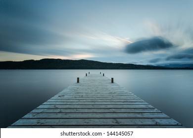 Wooden jetty at sunset, Lake Windermere in the English Lake District (UK) - Powered by Shutterstock