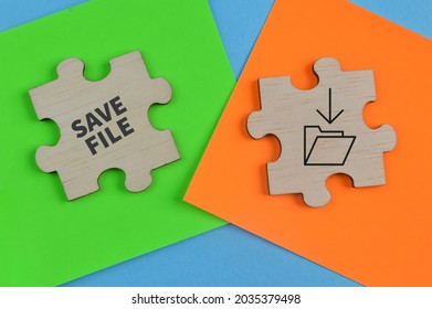 Wooden jigsaw puzzle with save file or save folder symbol