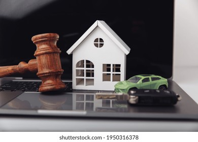 Wooden Judge Gavel With House And Car With Key. Auction And Bidding Concept