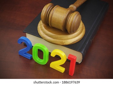 Wooden Judge Gavel, Legal Book And Numbers 2021. Concept Of New Laws And Rules In Year 2021.