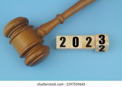 Wooden Judge Gavel And Numbers 2023 And 2023 On Wooden Cubes. Concept Of New Laws In Year 2023.