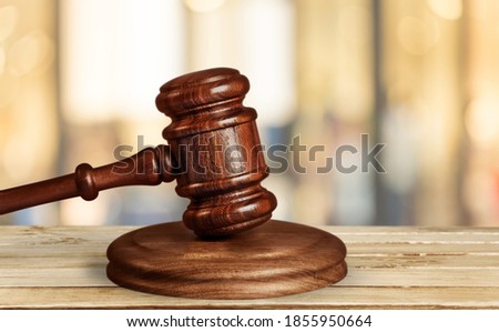 Wooden judge gavel on wood desk