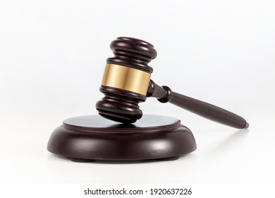 a wooden judge gavel and soundboard  on white background.
