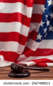 Wooden judge gavel and soundboard on american flag background. Justice of law system conceptual. - Shutterstock ID 2067488813