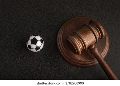 Wooden Judge Gavel And Toy Soccer Ball. Football Coach Accused. Concussion Lawsuit