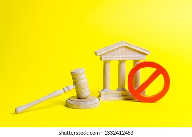 Wooden Judge Hammer And Government Building On A Yellow Background. Court. Concept Of The State Judicial System. Laws And The Constitution, Lack Of Supremacy Of Rights And Freedoms