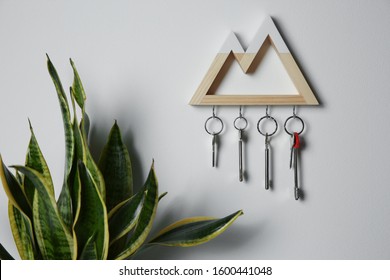 Wooden Key Holder On Light Wall Indoors