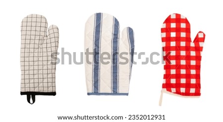 Wooden kitchen utensils, cutting board, potholder and glove isolated on white background. Kitchen Mitten and protective oven mitts on the table. Kitchenware. Kitchen accessories.Close-up.top view.