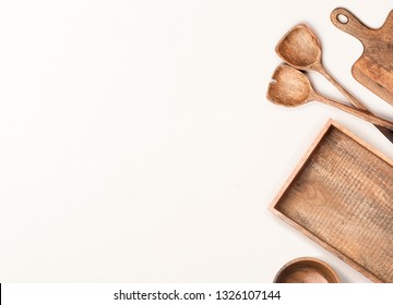 Wooden Kitchen Utensils On White Background. Flat Lay, Top View.