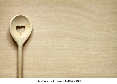 Wooden kitchenware on cutting board abstract food background