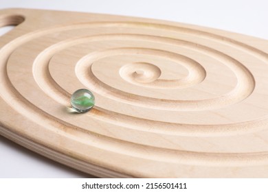Wooden labyrinth balance board on white background, closeup. Montessori toy - Shutterstock ID 2156501411