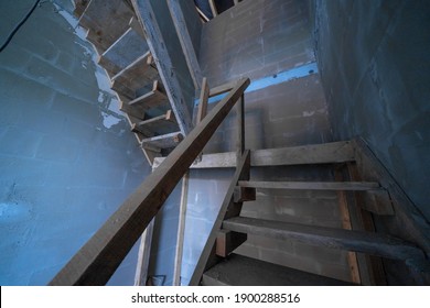 A Wooden Ladder In A House Under Construction. Upwards View.